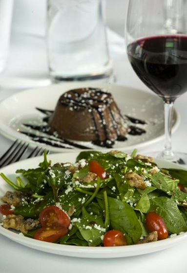 Spinach Salad with candied walnuts and goat cheese and Chocolate Lava cake are among the offerings in the living room theaters at Cinetopia.  Photo by Steven Lane
