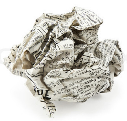 crumpled newspaper on a white background